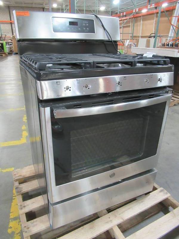 lot 3 image: GE 5-Burner Freestanding 5-cu ft Self-cleaning Convection Gas Range (Stainless Steel) 30 X 28 X 47 12 Tall JGB700SEJSS - Missing Parts and Dent on LH Side