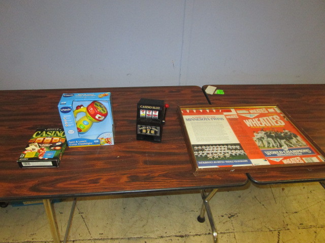 lot 319 image: 1987 MINNESOTA TWINS WHEATIES BOX, VTECH SPIN & LEARN FLASHLIGHT, HOYLE CASINO PC GAMES AND TOY SLOT MACHINE