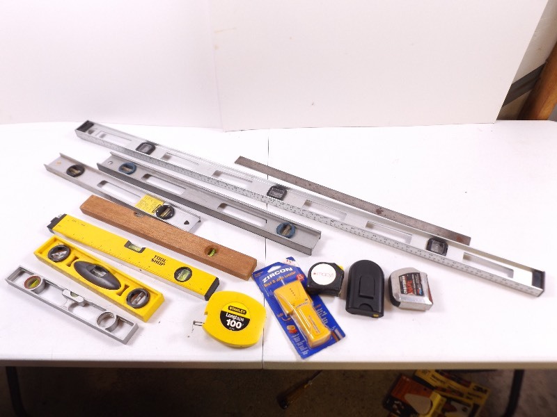 lot 31 image: Lot of Levels, Tape Measures, and Stud Finders
