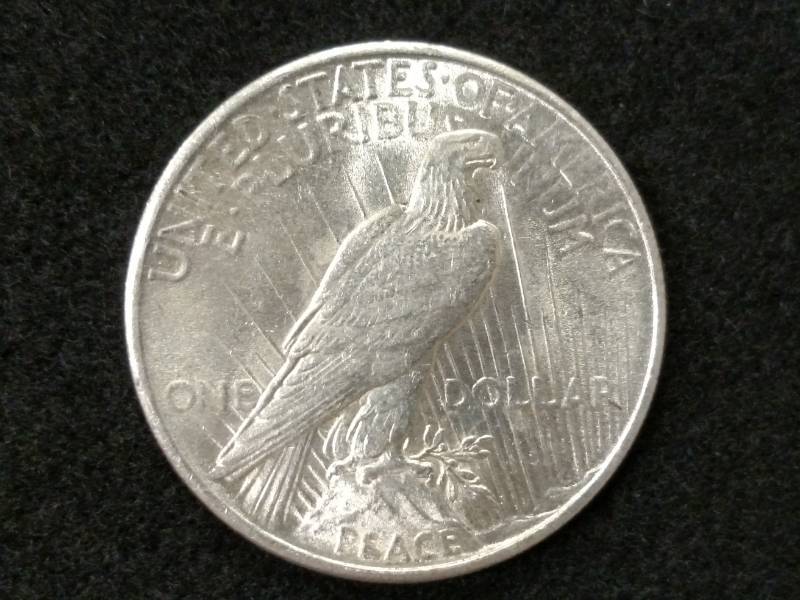 lot 101 image: 1925 High Grade Peace Silver Dollar...
