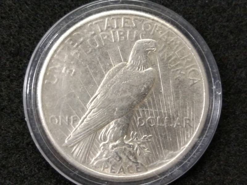 lot 102 image: 1925 Peace Silver Dollar...