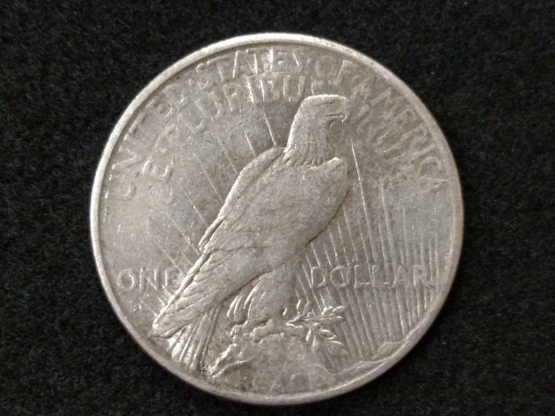 lot 103 image: 1925 S Peace Silver Dollar...
