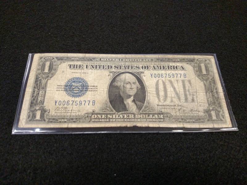 lot 187 image: 1928 A One Dollar Funny Back Silver...