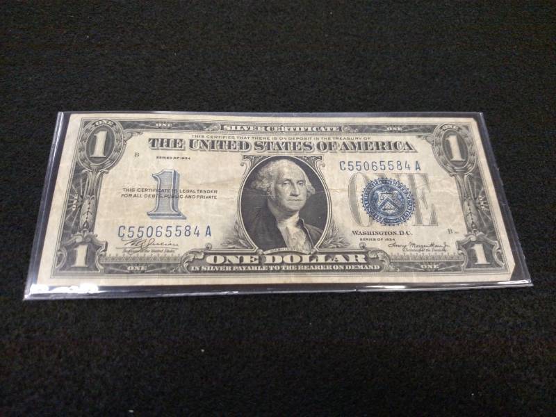 lot 188 image: 1934 One Dollar Funny Back Silver C...