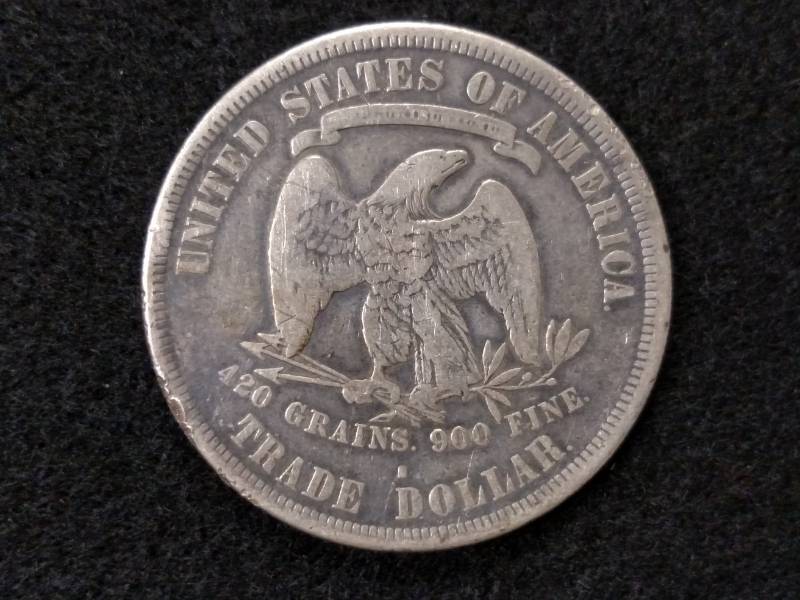 lot 5 image: 1877 S Trade Silver Dollar...
