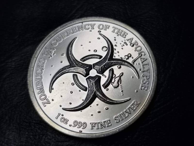 lot 34 image: 1 TROY OZ. .999 FINE SILVER 2018 ZOMBUCKS FEAST
