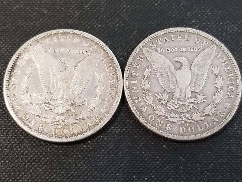 lot 25-A image: 2 MORGAN SILVER DOLLARS 1899-O 1900-O