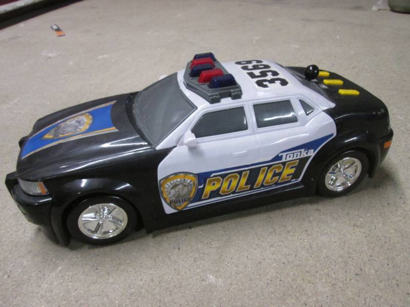 Battery Operated Tonka Police Car a Mowers Flooring Clothes