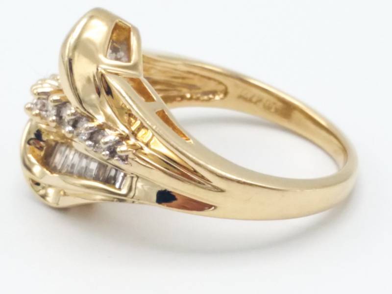 lot 8 image: Ladies Round and Baguette Diamond Ring in 14k Yellow Gold