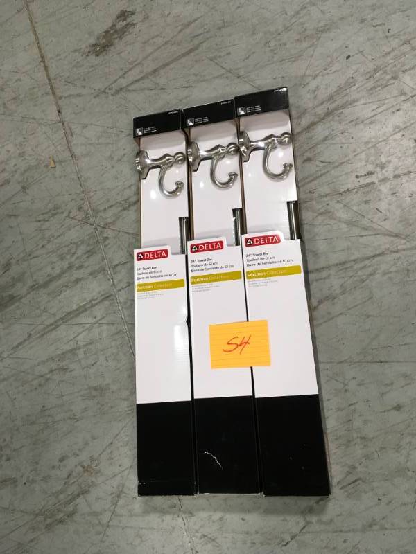 lot 54 image: Delta Portman 24 in. Towel Bar in Brushed Nickel  in good condition