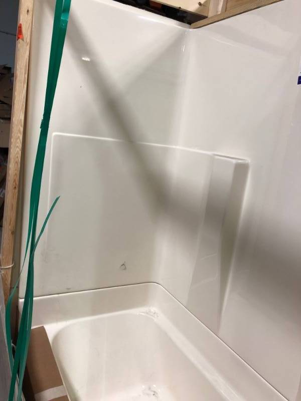 lot 109 image: Aquatic Remodeline 60 in. x 30 in. x 72 in. 2-Piece Bath and Shower Kit with Right Drain in Biscuit in good conditions whit small damage on the wall