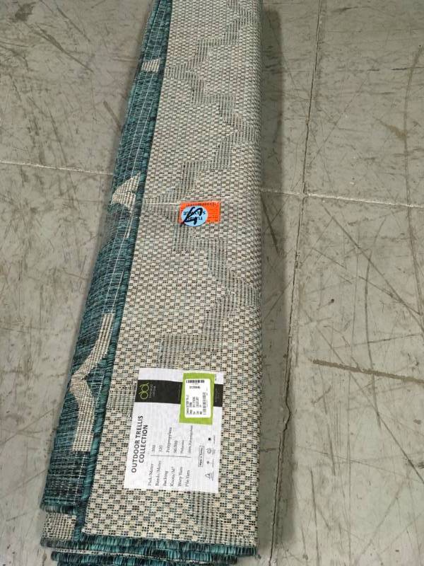 lot 47 image: Unique Loom Outdoor Trellis Teal 9 0 x 12 0 Area Rug not used