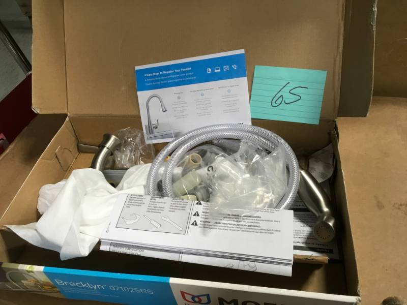 lot 65 image: MOEN Noell Single-Handle Standard Kitchen Faucet with Side Sprayer in Spot Resist Stainless in good condition