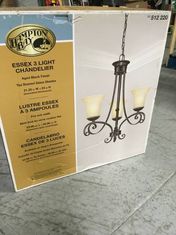 lot 66 image: Hampton Bay Essex 3-Light Aged Black Chandelier with Tea Stained Glass Shades in good condition