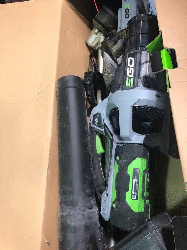 lot 104 image: EGO POWER 56-Volt 15 in. Rapid Reload String Trimmer & 530 CFM Blower Combo Kit used in good condition