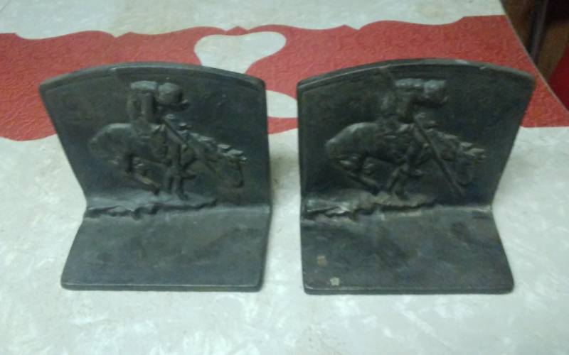 lot 25 image: Pair Of Cast Iron Cowboy Book Ends