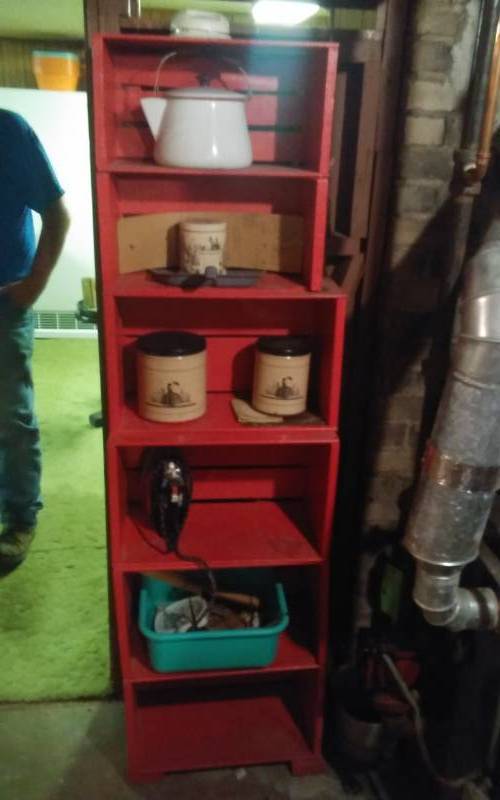lot 28 image: Painted Crates Made Into Stacked Shelf (20x11x68) With Contents (Tins, Kettle, Iron Misc)