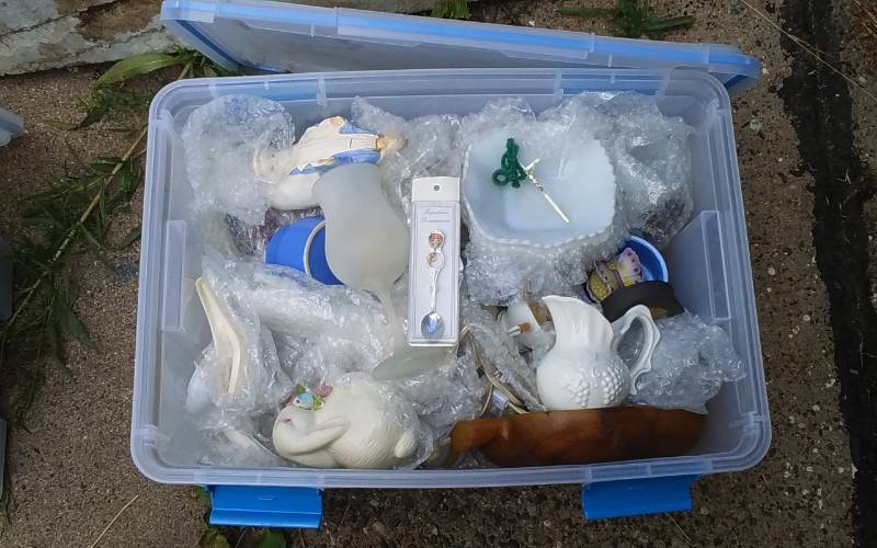 lot 54 image: Sterilite 54-Qt Gasket Bin With Lid & Unknown Wrapped Contents
