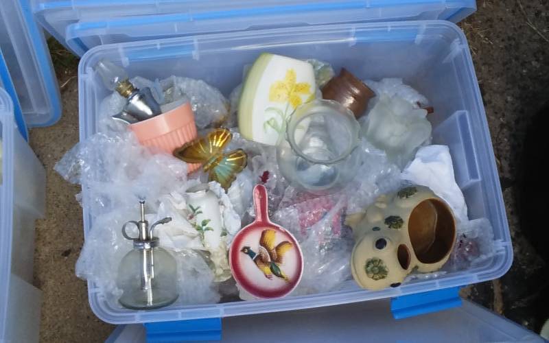 lot 68 image: Sterilite 54-Qt Gasket Bin With Lid & Unknown Wrapped Contents