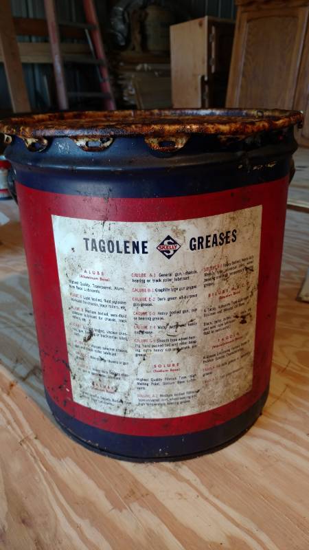 lot 12 image: 5 gallon skelly tagolene grease can full with unique wood handle