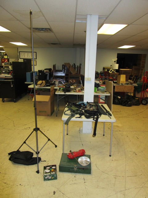 lot 411 image: GUN HOLSTERS, GERBER BUSH KNIFE, CAMPING GEAR, AND A FOLDING TABLE