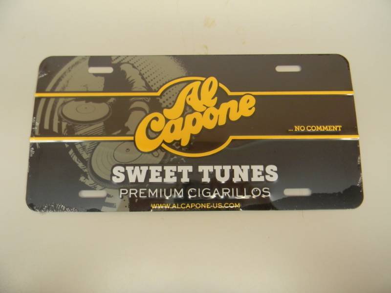 lot 3 image: NOS AL CAPONE ...NO COMMENT SWEET TUNES PREMIUM CIGARILLOS TIN SIGN - STILL IN PLASTIC WRAP - APPROX 12 BY 6 - SEE PICTURES