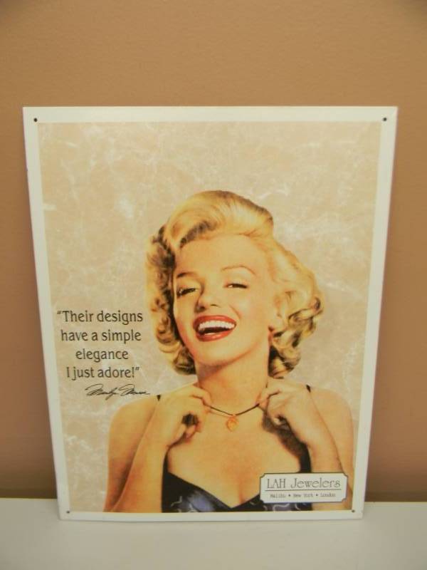 lot 24 image: MARILYN MONROE LAH JEWELERS TIN SIGN - NICE - APPROX 13 BY 16 - SEE PICTURES