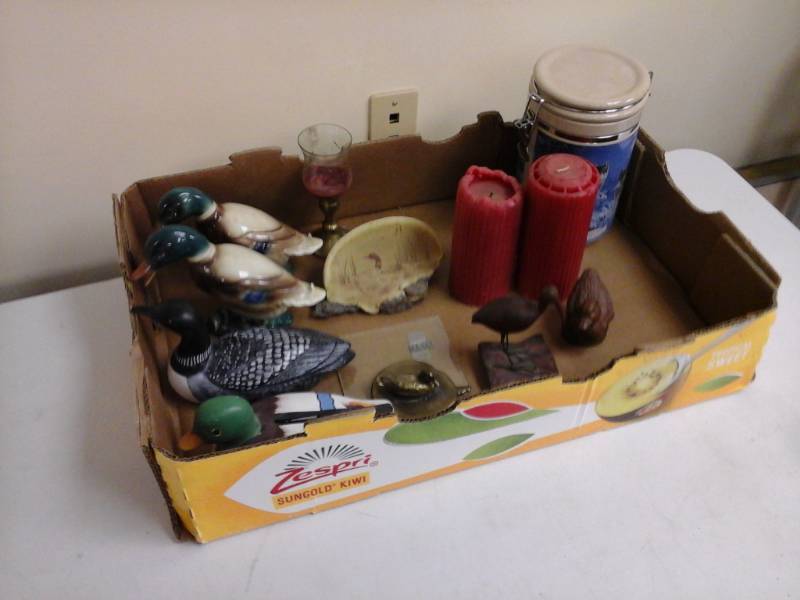 lot 908 image: Mallard Ceramic Table Dcor, Tall Red Candles, BrassGlass Candleholder, Driftwood Dcor, Brass Duck Dcor