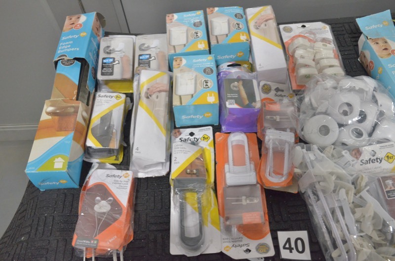 lot 40 image: SAFETY FIRST Lot of child safety door knob covers, cabinet locks, tvfurniture strap, outlet cover
