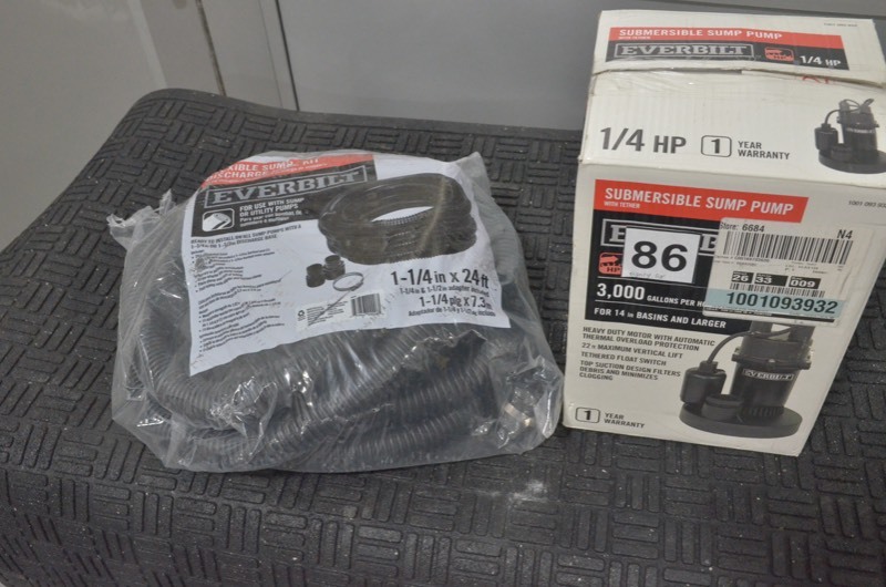 lot 86 image: Everbilt 14 HP Submersible Sump Pump with Tether AND flexible sump discharge kit