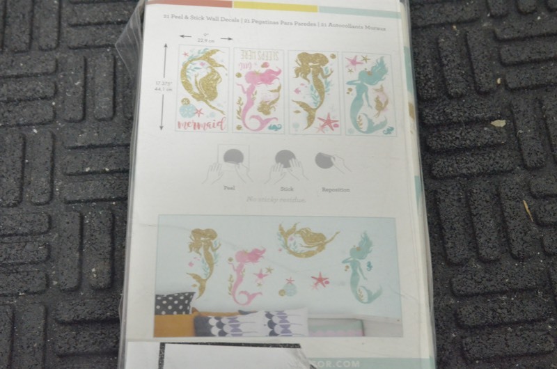 lot 115 image: RoomMates 5 in. x 11.5 in. Mermaid 21-Piece Peel and Stick Wall Decals with Glitter