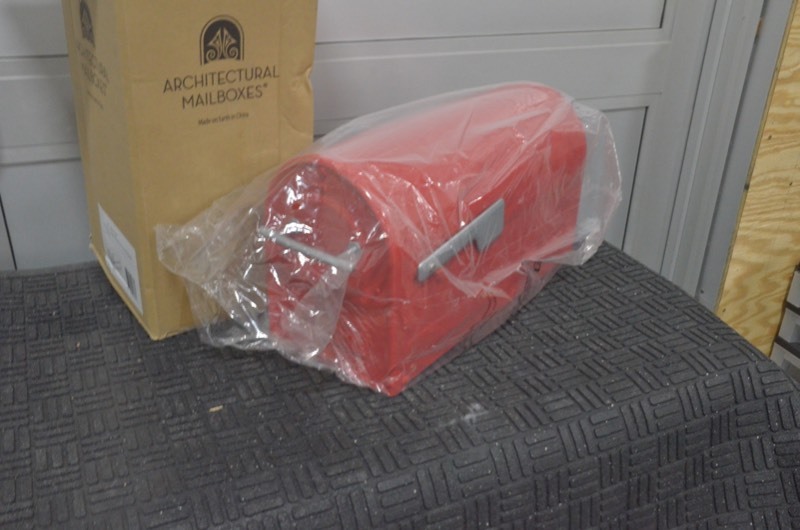lot 174 image: ARCHITECTURAL MAILBOXES Boulder Red Post Mount Mailbox with Silver Flag