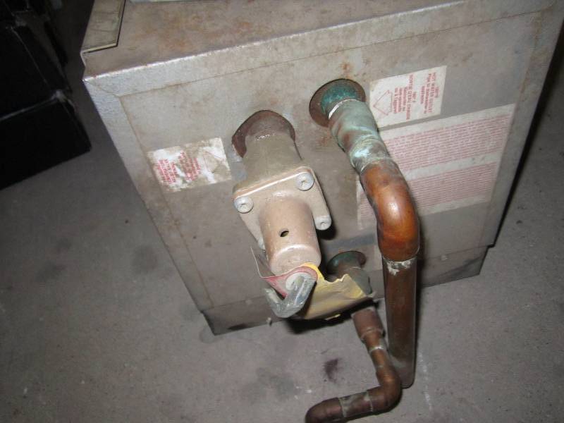 lot 318 image: Electric water heater and forced air heater