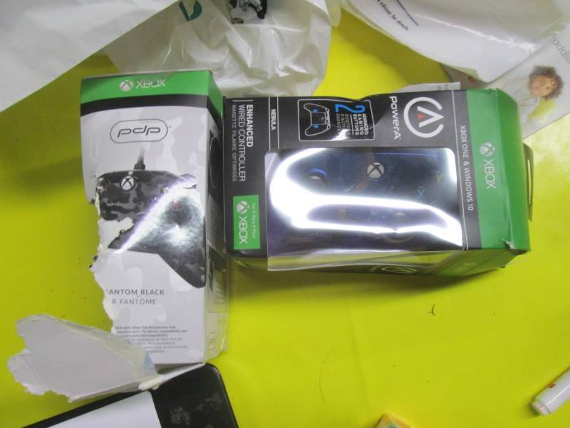 lot 115 image: lot of 2 xbox one and ps4 controlle...