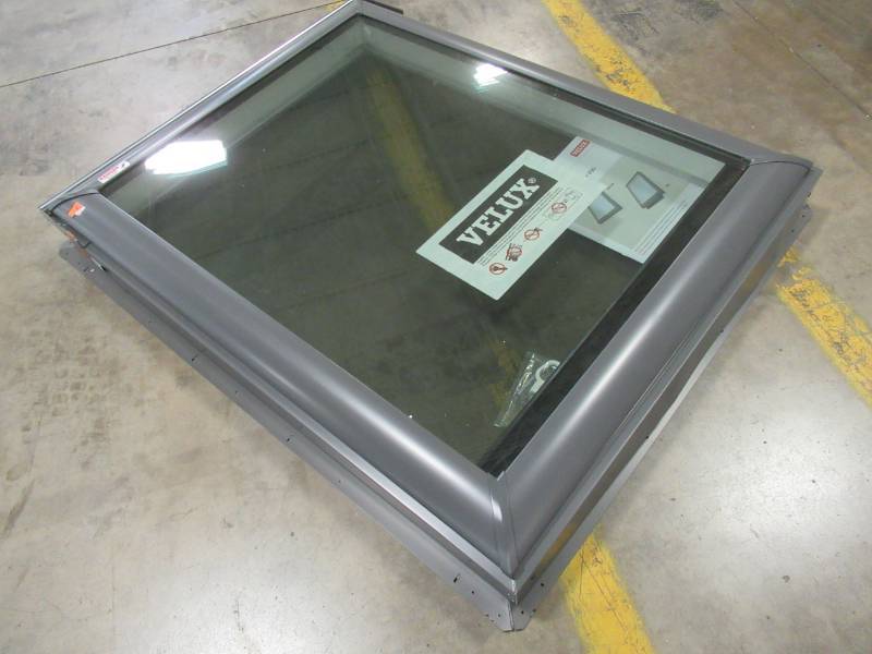 lot 54 image: Velux 31-12 in. x 39 12. Egress Top Hinged Roof Window with Laminated LowE3 Glass GPU MK06 0060R - Slight dent on inside screen frame and small crack in interior wood frame.
