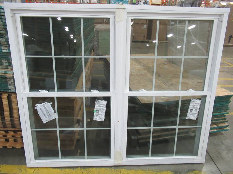 lot 93 image: Custom Dual Double Hung Vinyl Window With Low E Glass and Internal Grates. Measures 70 X 58 X 3 14 - Broken Glass Pane on Bottom inside Right