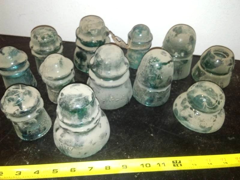 lot 269 image: 12 green glass insulators
