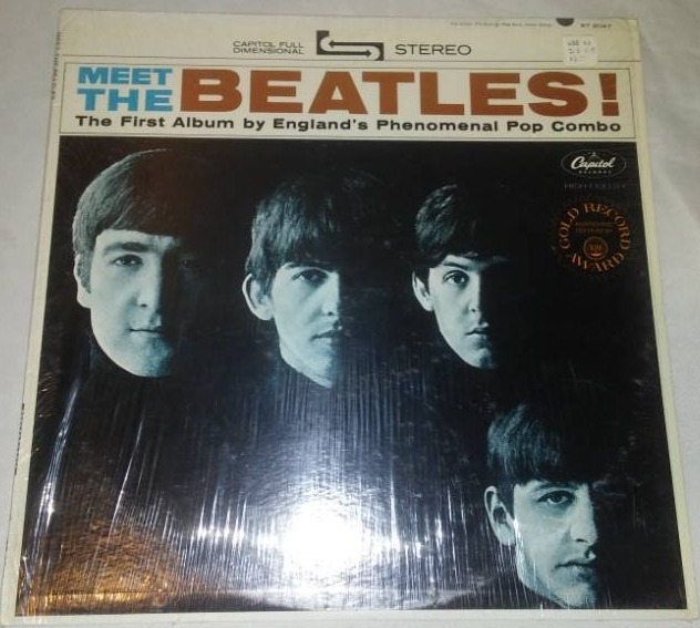 lot 298 image: Meet The Beatles album with cellophane and price take. Near mint condition.
