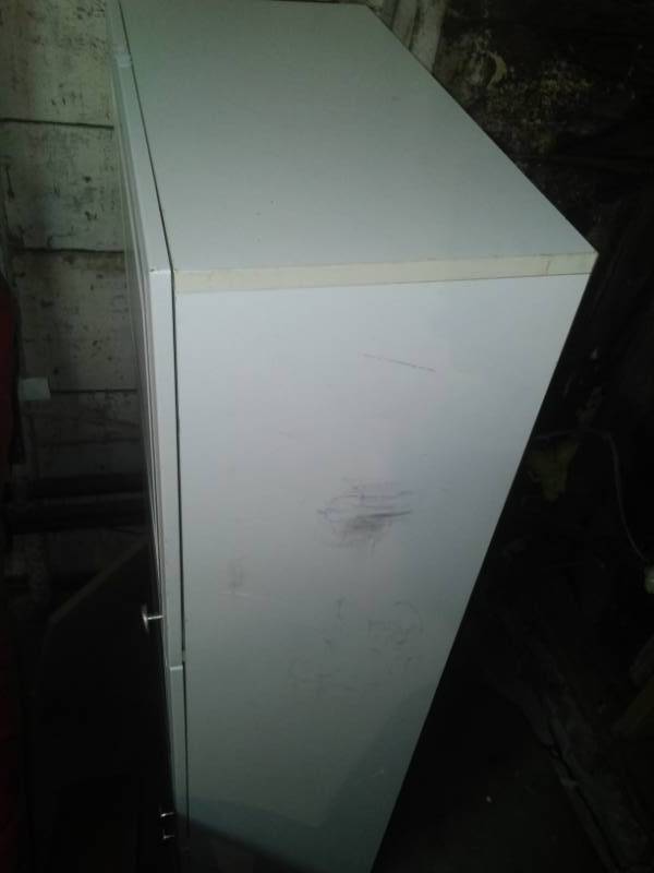 lot 23 image: White upper cabinet 3 door. 54 x 24 x 12.