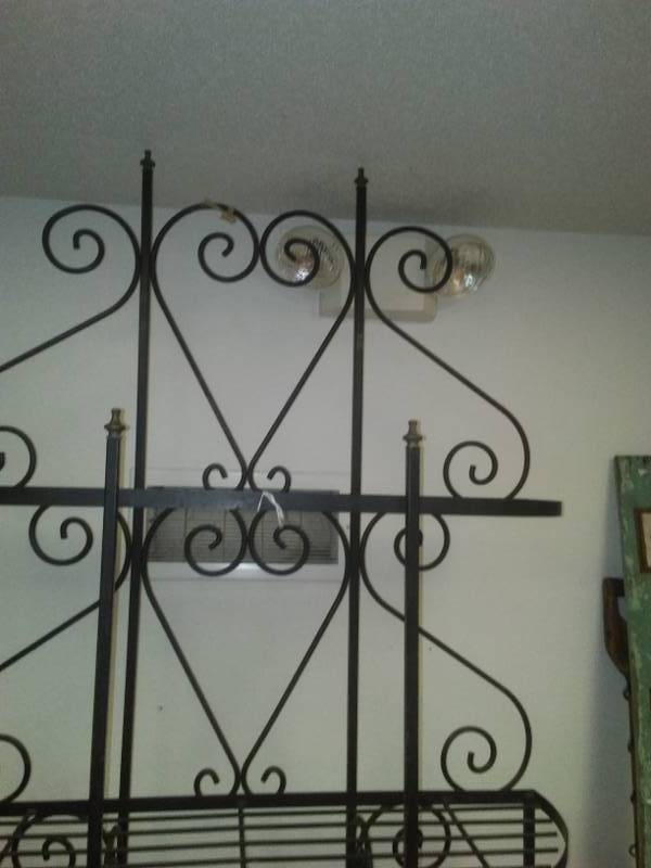 lot 68 image: Wrought iron bakers rack.