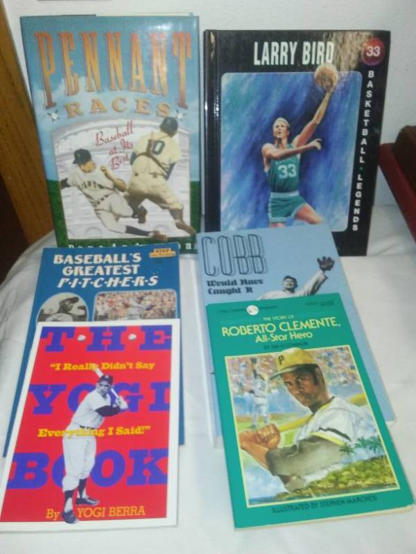 lot 148 image: 6 Sports books, Yogi Berra, Ty Cobb, Bird, Clemente  more all excellent.