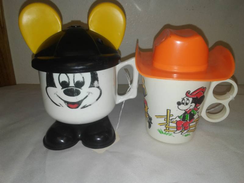 lot 208 image: Rare Vintage Disney Mickey Mouse Cups with covers.