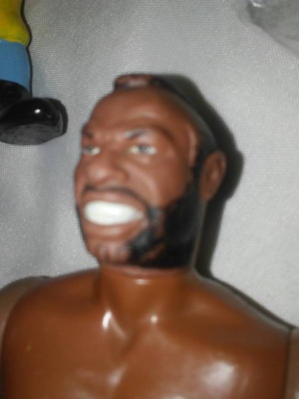 lot 223 image: Variety of figures, Mr. T,  Homer Simpson, Superman, Snoopy, Blue Bonnet Sue, Feivel and more.