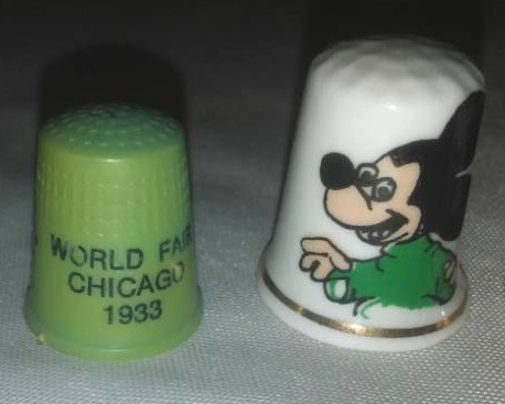 lot 290 image: 2 1933 Worlds Fair Chicago Sewing Thimbles, 3 Disney Thimbles.