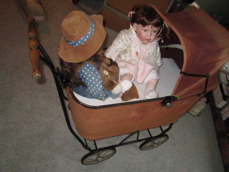 lot 19 image: Antique buggy with porcelain dolls...