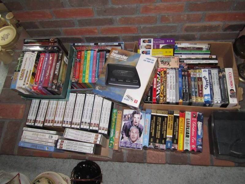 lot 23 image: VHS rewinder, tapes, case, DVDs...