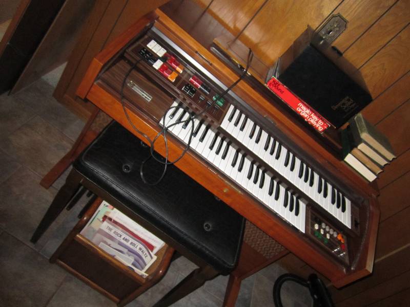lot 42 image: Organ with headphones and sheet mus...