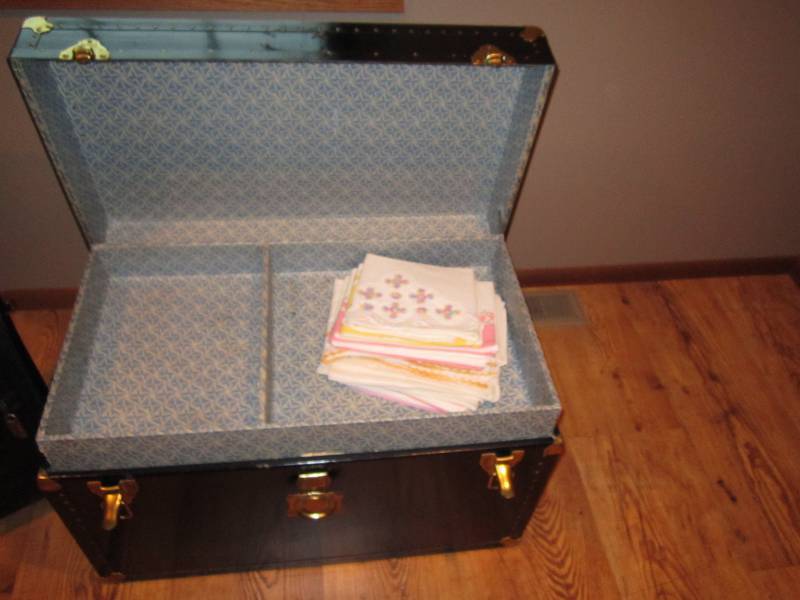lot 63 image: Black trunk...