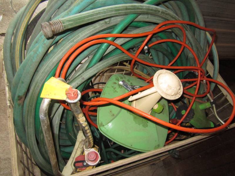 lot 106 image: Basket with garden hoses, sprinkler...