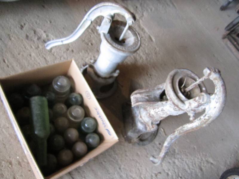 lot 110 image: Water hand pumps and glass insulato...